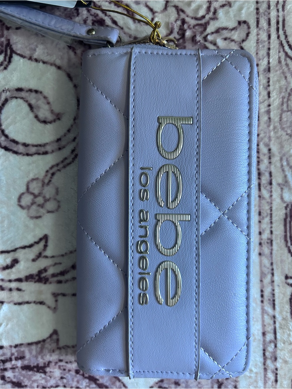 bebe leather Lavender Wristlet with Gold Logo(start your Christmas shopping)